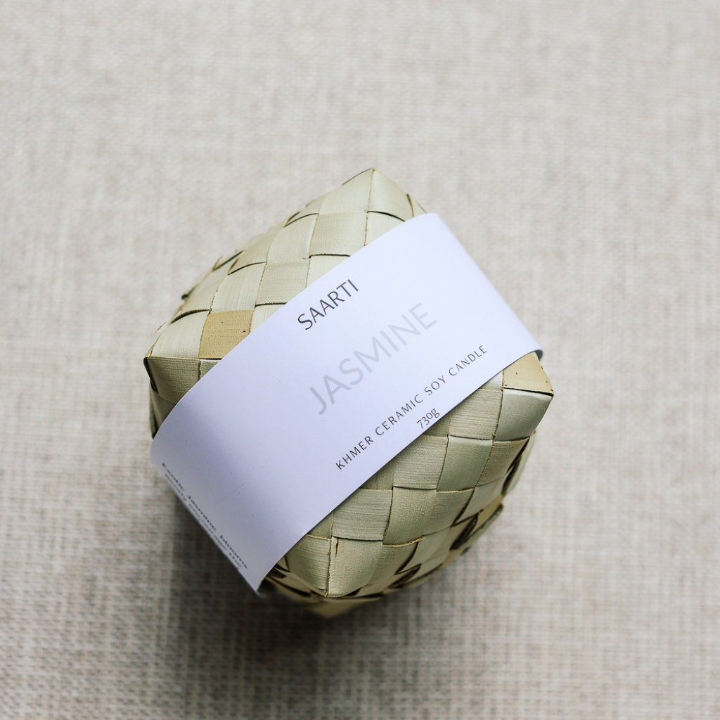Soy candle with Jasmine essential oil. Handmade white ceramic candle, gifts Cambodia, made in Cambodia. Natural palm leaf packaging.