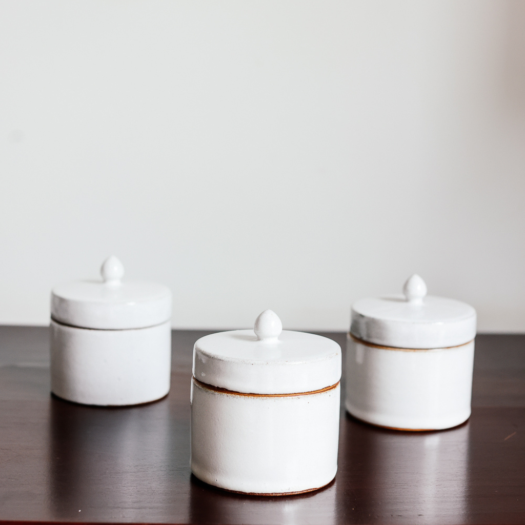 Soy candle with Jasmine essential oil. Handmade white ceramic candle, gifts Cambodia, made in Cambodia. Natural palm leaf packaging.